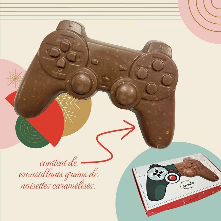 Manette de jeu de Nol en chocolat lait contenant des grains de noisettes caramlises